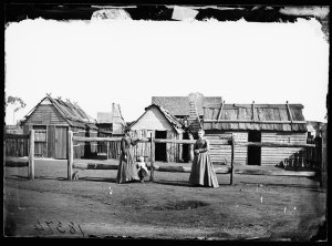 Photo taken 1870s. Louisa Lawson, her son Charles and her sister Phoebe Albury, outside Miss Albury's dressmaking shop, Gulgong area